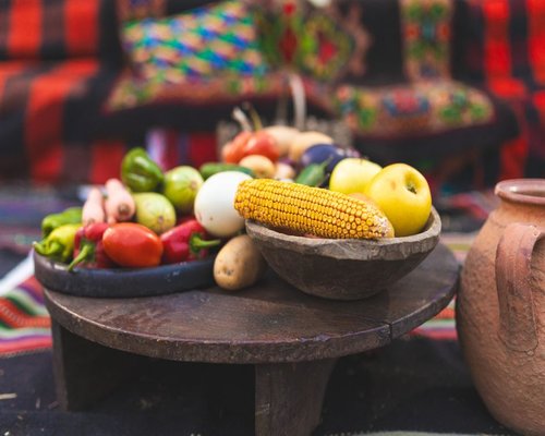 Fresh vegetables and fruits arranged naturally in a traditional Colombian kitchen