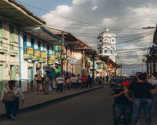 Colombian city street scene with people walking comfortably